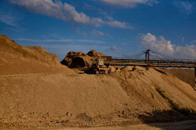 Built structure on land against sky