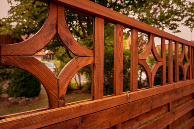 Close-up of railing against plants