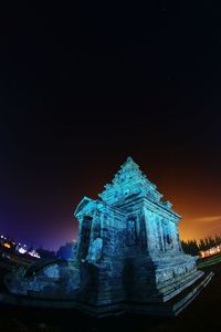 Low angle view of illuminated temple against sky at night