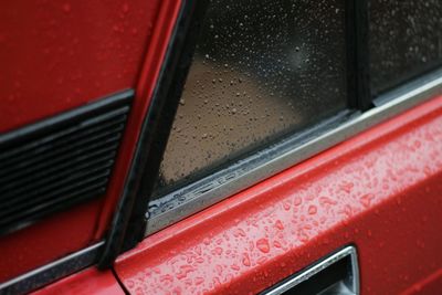 Close-up of raindrops on car