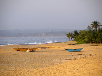 Scenic view of beach against clear sky