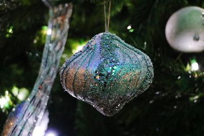 Close-up of christmas ornament hanging on tree