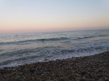 Scenic view of sea against clear sky during sunset