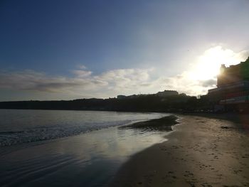 Scenic view of beach against sky during sunset