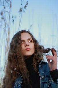 Portrait of beautiful young woman looking at camera