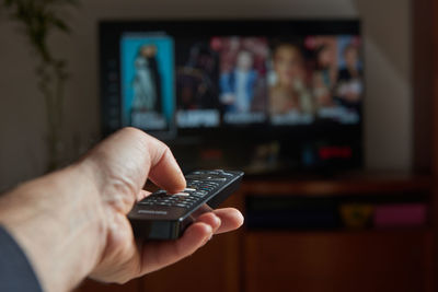 Midsection of man using mobile phone