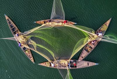 Aerial view of fishing boats in sea