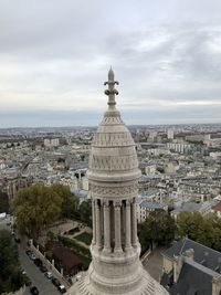 High angle view of buildings in city against sky