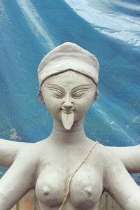 Close-up of statue by swimming pool