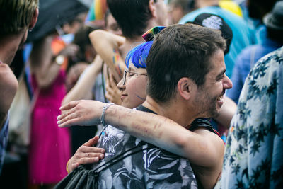 Young couple kissing in music concert