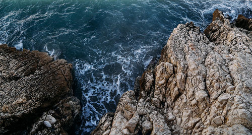 High angle view of rock formation at sea shore