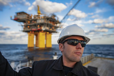 Offshore energy production with person on ship