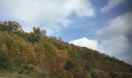 Scenic view of mountains against cloudy sky