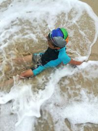 High angle view of man surfing on rock