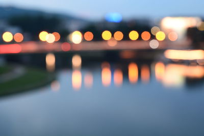 Defocused image of illuminated city at night