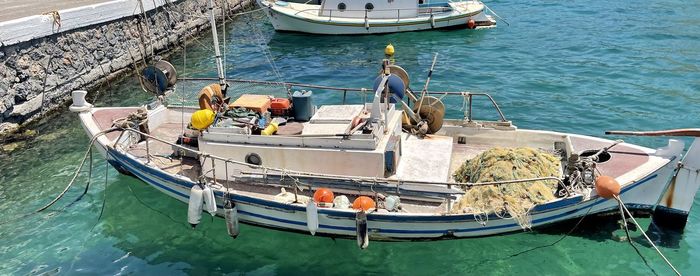 High angle view of fishing boats moored in sea