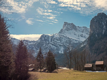 Scenic view of snowcapped mountains against sky