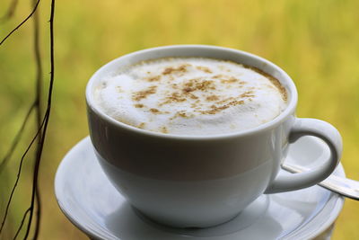 Close-up of cappuccino on table