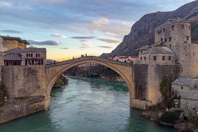 Bridge over river against sky