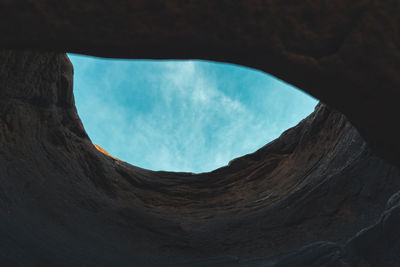 Low angle view of rock formation against sky