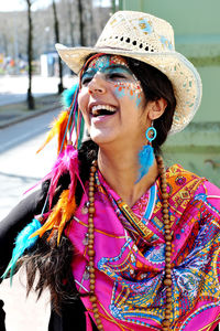 Smiling happy woman wearing hat and jewelry