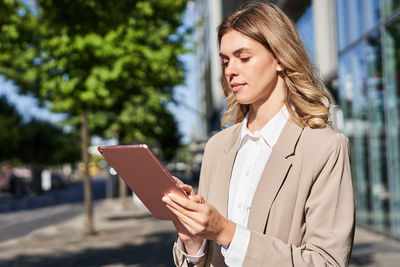 Young woman using digital tablet