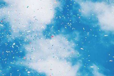 Low angle view of balloons against sky