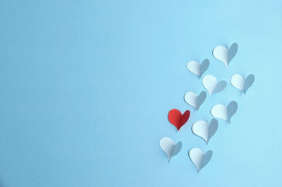 High angle view of heart shape against blue background