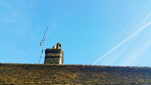 Low angle view of built structure against blue sky