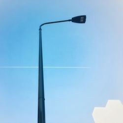 Low angle view of street light against clear blue sky