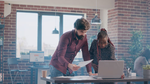 Business colleagues working at office