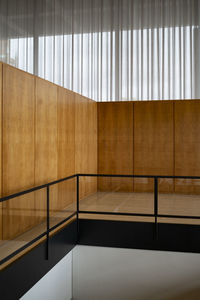 Wood panel against long curtains inside neue nationalgalerie, berlin