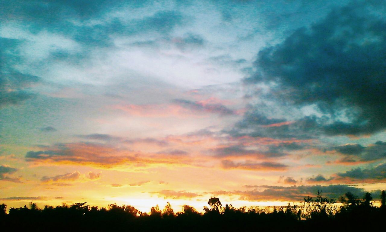 sunset, silhouette, sky, beauty in nature, scenics, tranquility, tranquil scene, cloud - sky, orange color, tree, dramatic sky, nature, idyllic, cloud, low angle view, cloudy, landscape, moody sky, outdoors, majestic