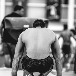 Rear view of athlete exercising in gym