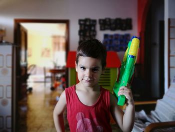 Portrait of boy smiling at home