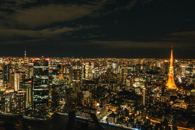 High angle view of illuminated city buildings at night