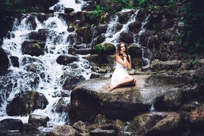 Woman standing on rocks