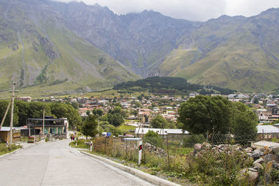  city view of stepantsminda, georgia. old houses and mountain view.