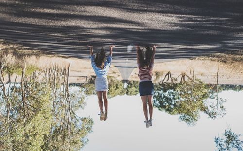 Rear view of couple walking on street