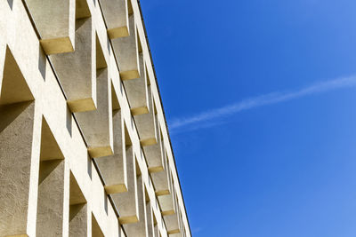 Low angle view of building against clear blue sky