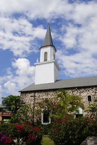 Low angle view of clock tower against sky