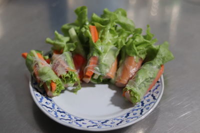 High angle view of vegetables in plate on table