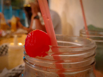 Close-up of drink in glass jar on table