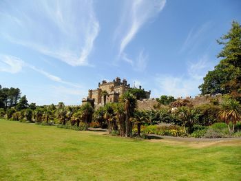 Panoramic view of trees and building against sky