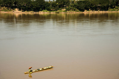 High angle view of people in boat on lake