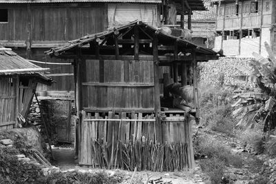 Old wooden house by building