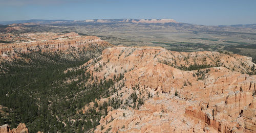 Scenic view of landscape and mountains against sky