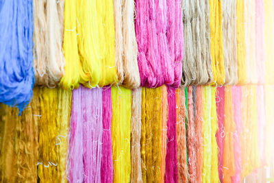 Close-up of multi colored clothes hanging on clothesline