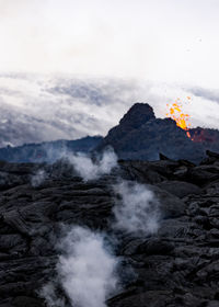 Scenic view of volcanic mountain against sky