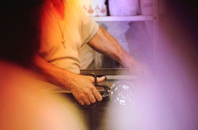 Midsection of woman holding hands